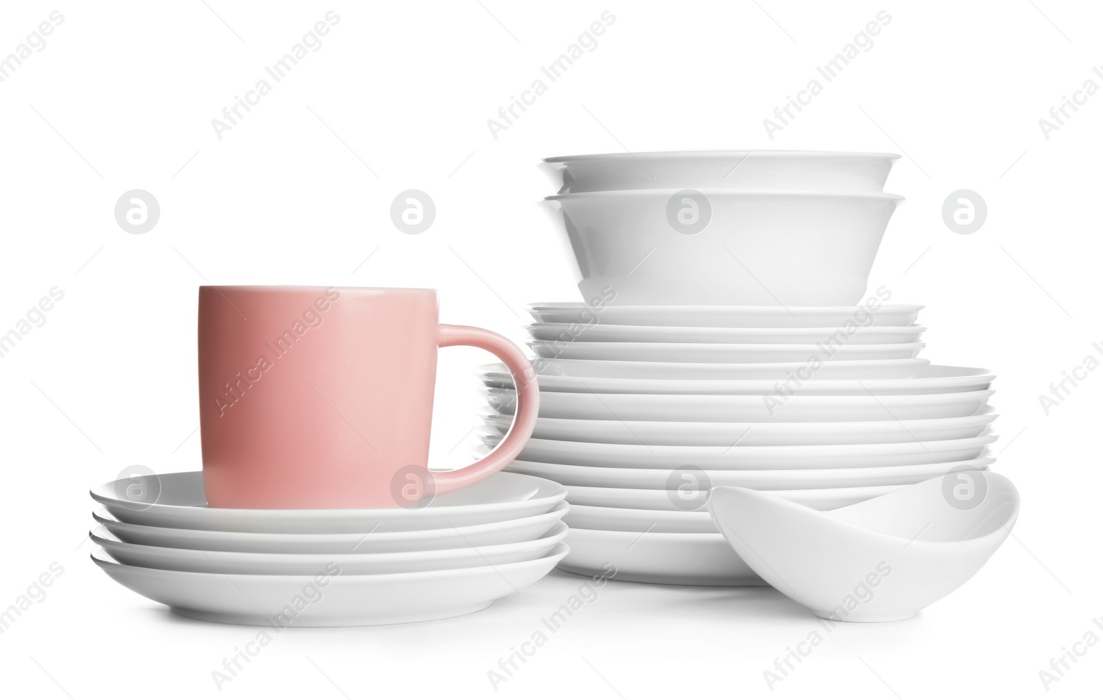 Photo of Stacks of ceramic dishware on white background