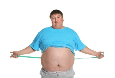 Emotional overweight man with measuring tape on white background