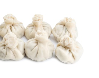 Photo of Many tasty khinkali (dumplings) isolated on white. Georgian cuisine