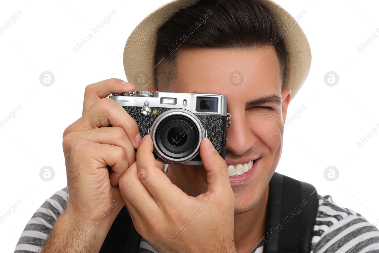 Photo of Man with straw hat taking picture on white background, closeup. Summer travel