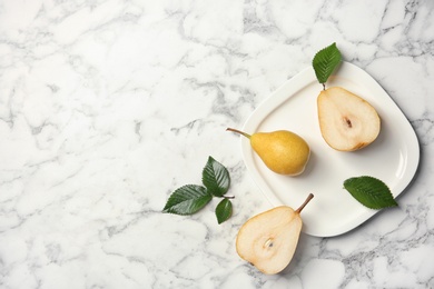 Photo of Flat lay composition with ripe pears on marble background, top view. Space for text