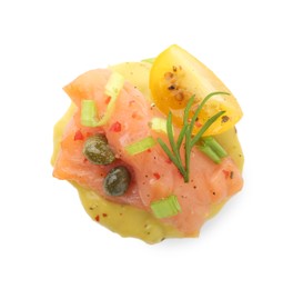 Photo of Tasty canape with salmon, tomatoes, capers and herbs isolated on white, top view