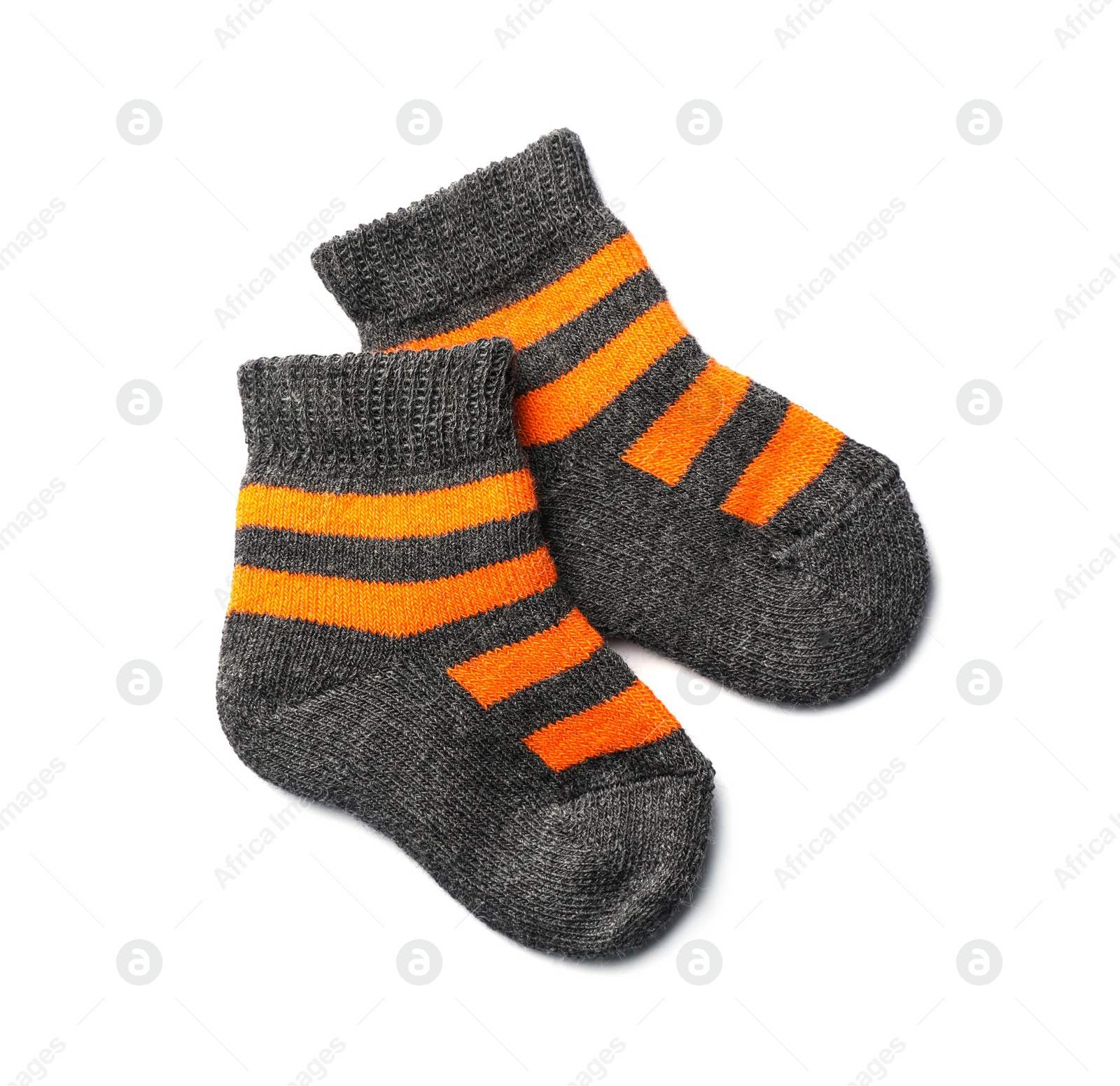 Photo of Cute child socks on white background, top view