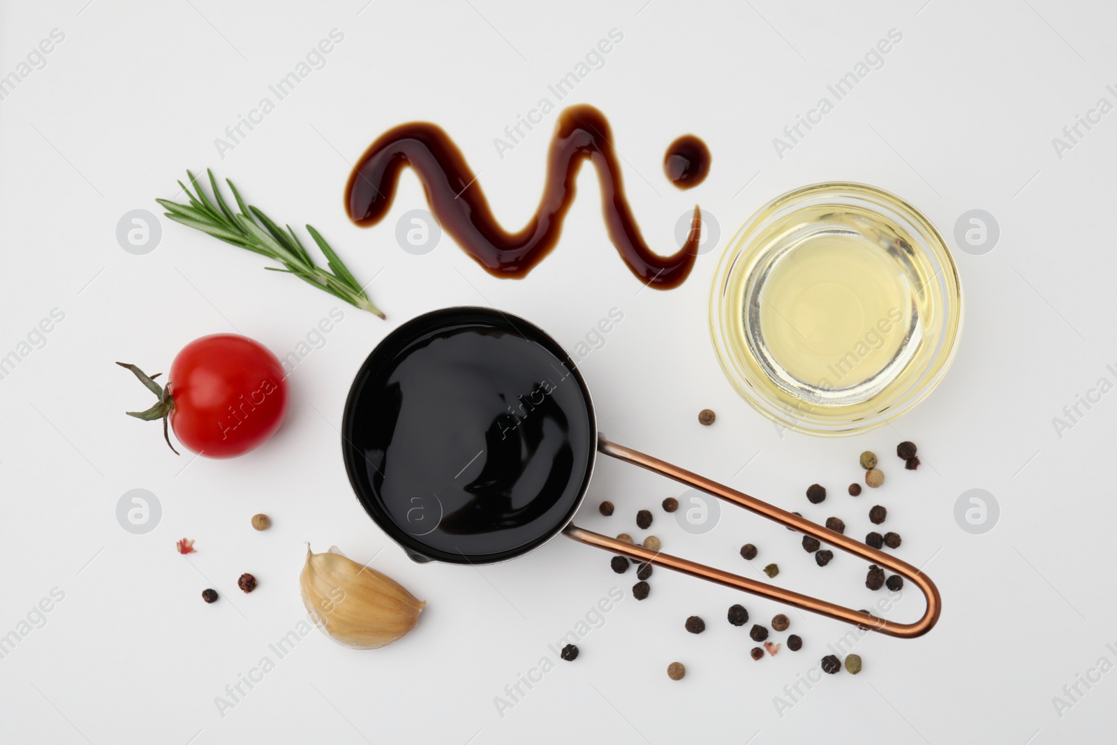 Photo of Organic balsamic vinegar and cooking ingredients on white background, flat lay