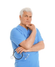 Portrait of pensive male doctor in scrubs with stethoscope isolated on white. Medical staff