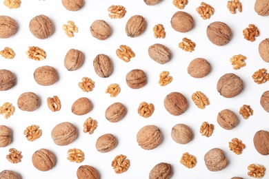 Flat lay composition with walnuts on white background