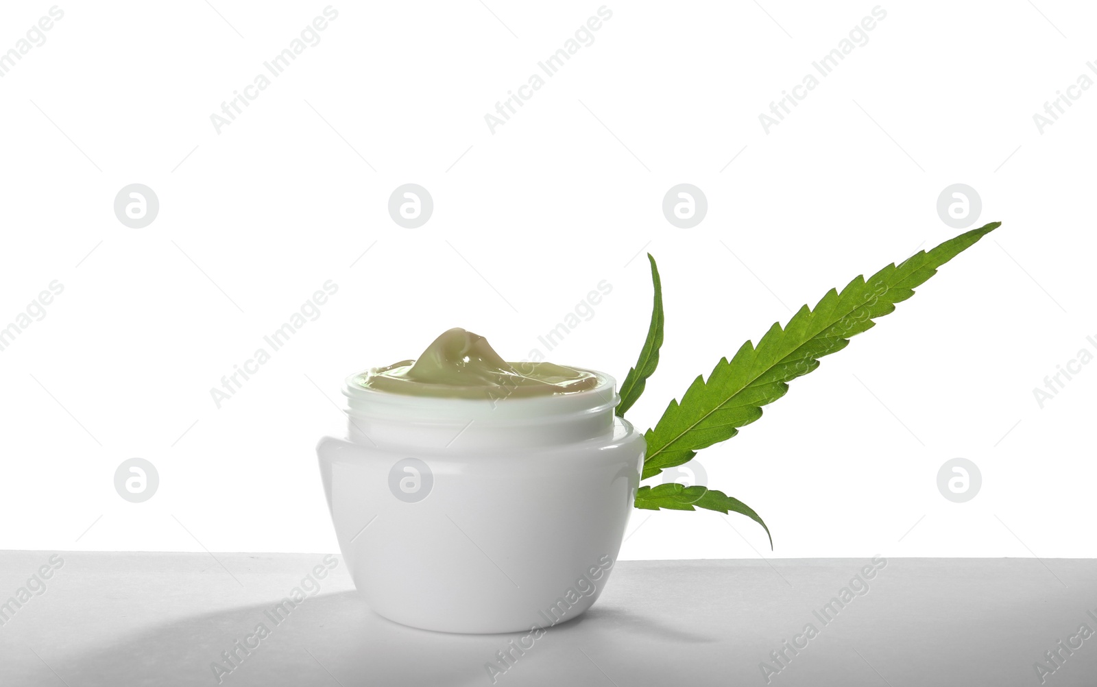 Photo of Jar with hemp lotion on white background