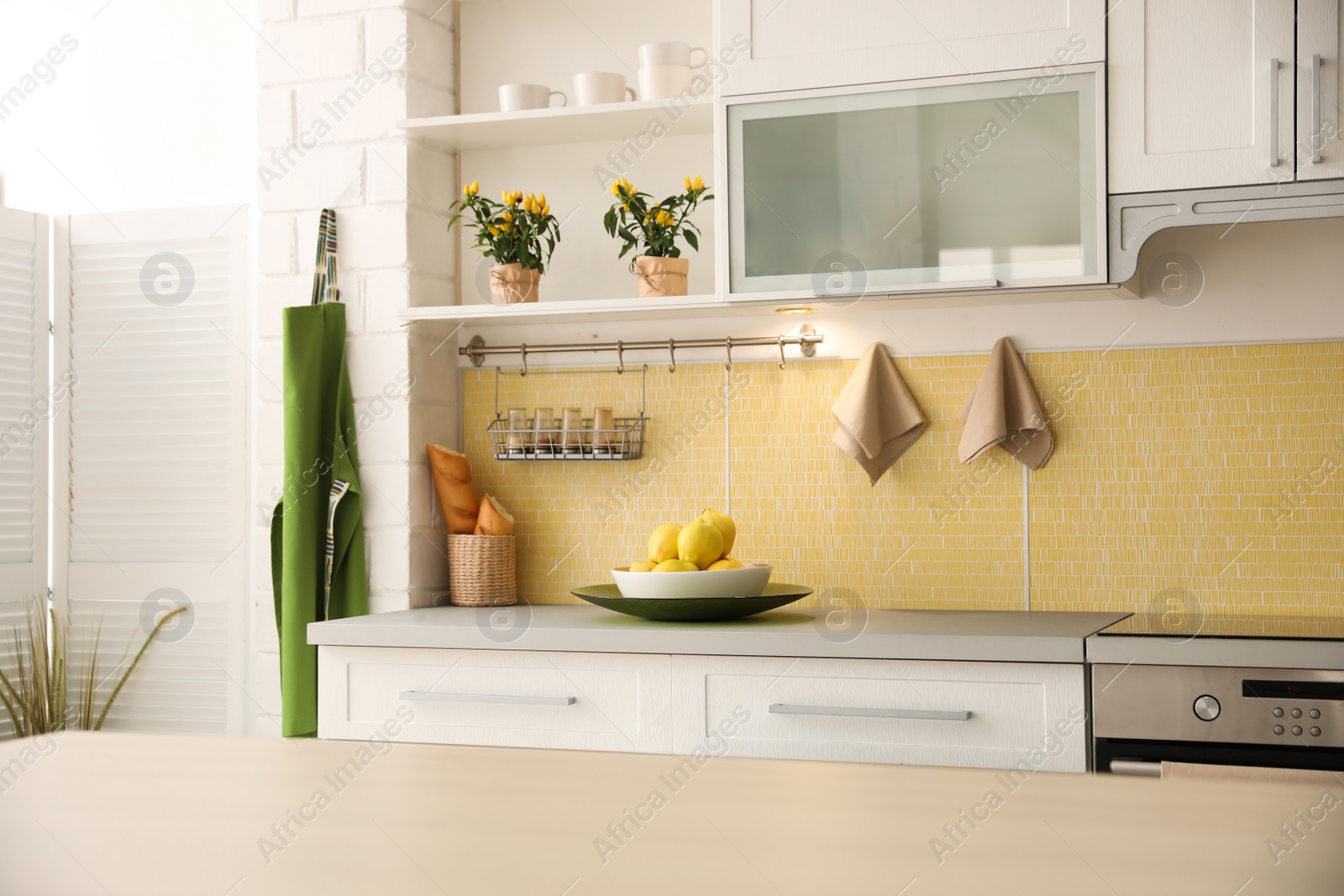 Photo of Modern kitchen interior with stylish white furniture