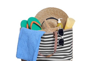Photo of Stylish bag with skin care products and other beach accessories isolated on white