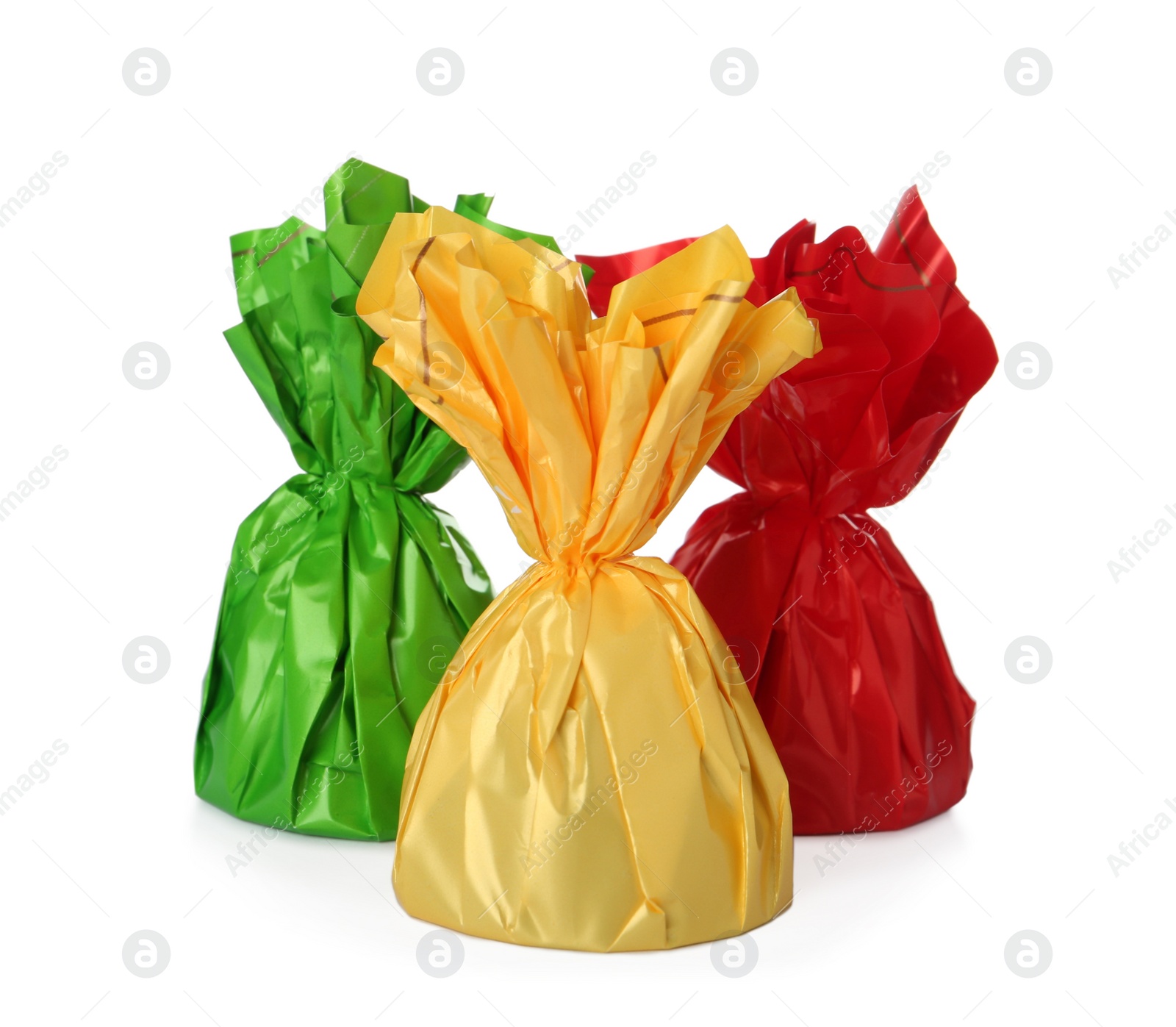 Photo of Delicious candies in colorful wrappers on white background