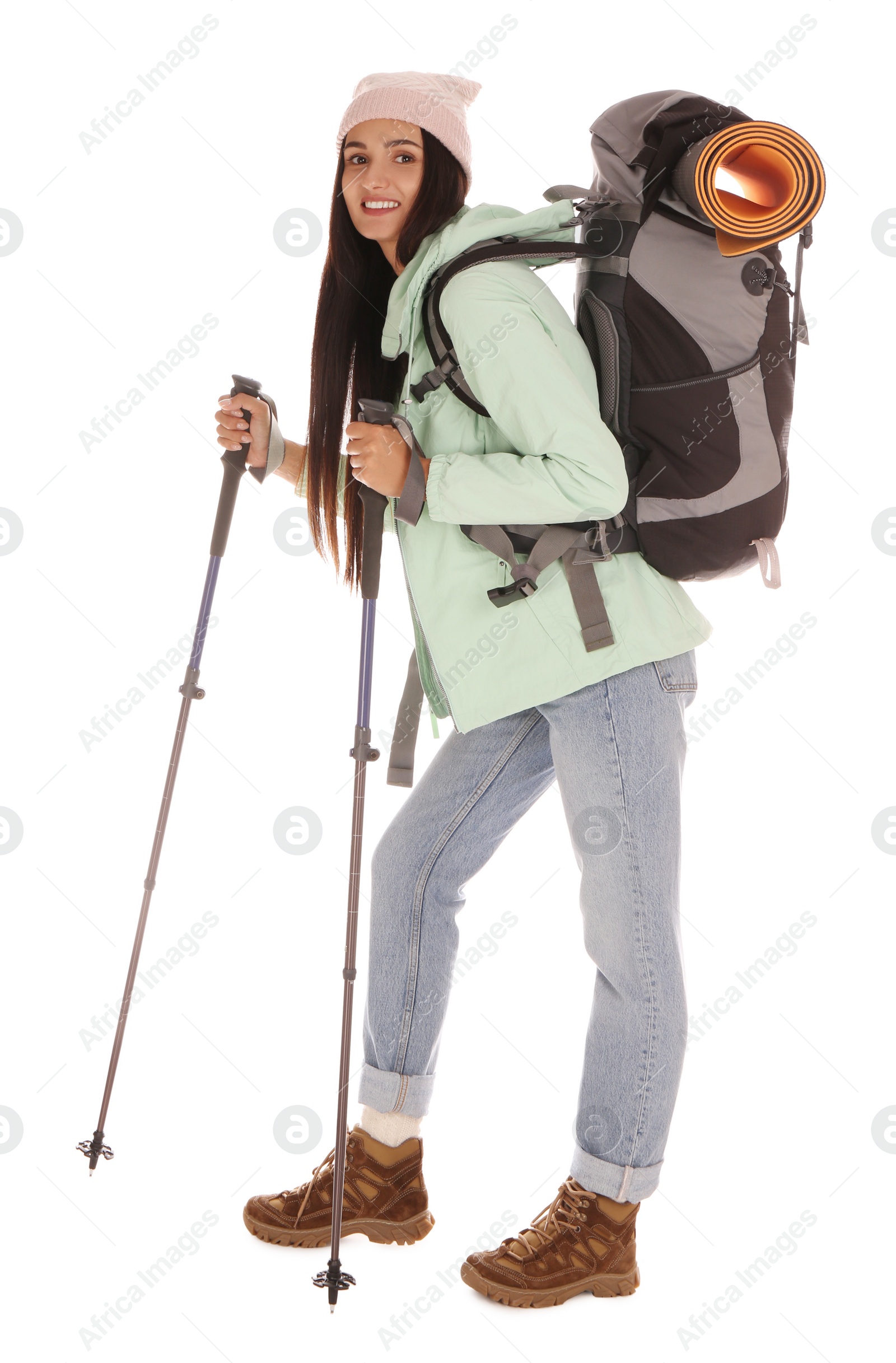 Photo of Female hiker with backpack and trekking poles on white background