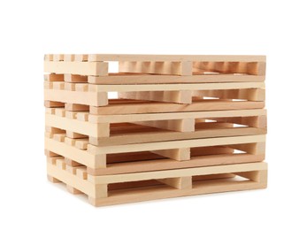 Photo of Stack of small wooden pallets on white background