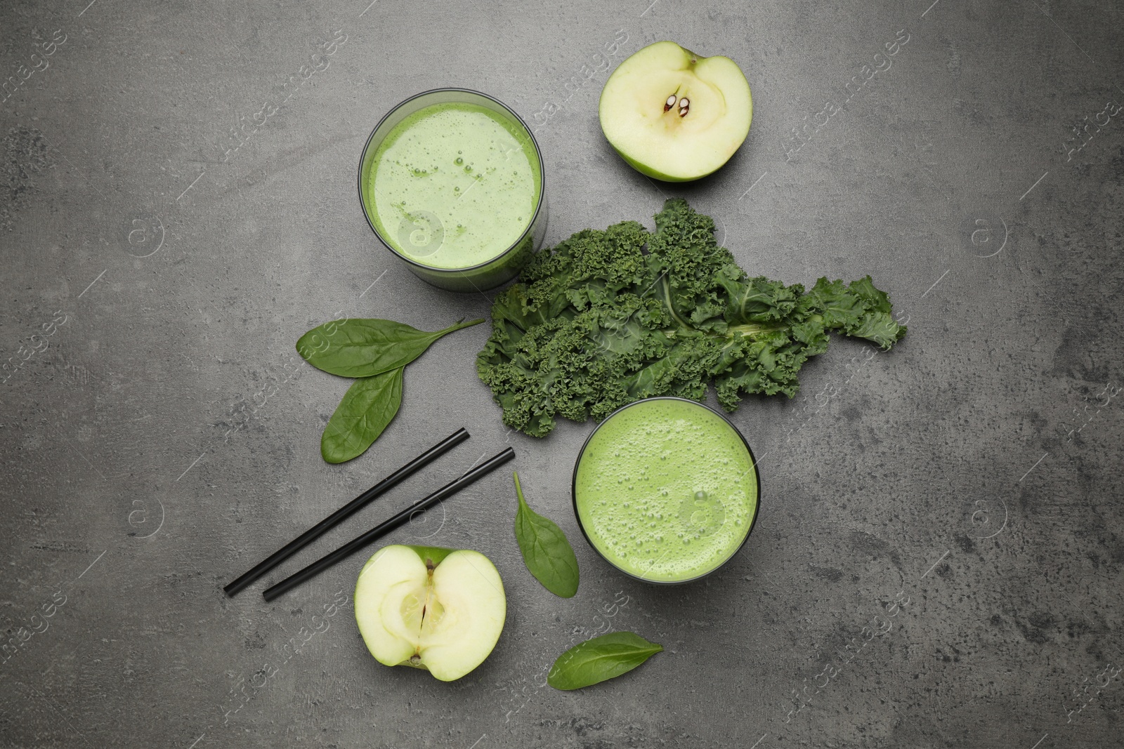 Photo of Flat lay composition with kale smoothie on grey table