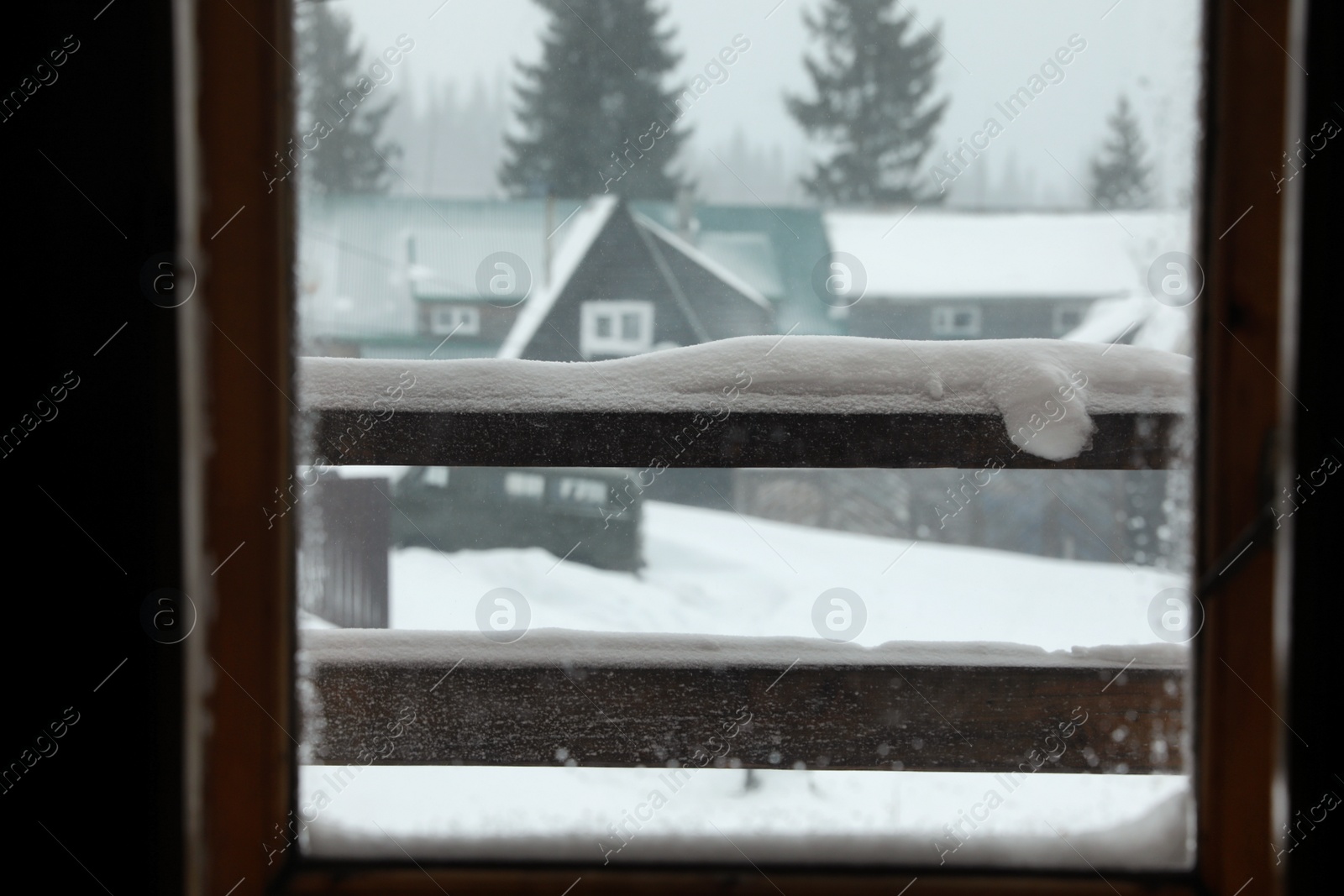 Photo of View of beautiful landscape through window. Winter vacation