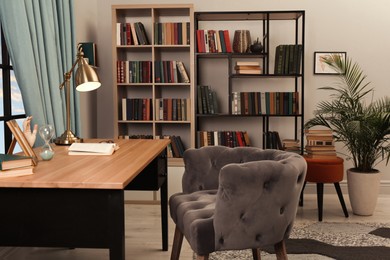 Photo of Cozy home library interior with collection of different books on shelves