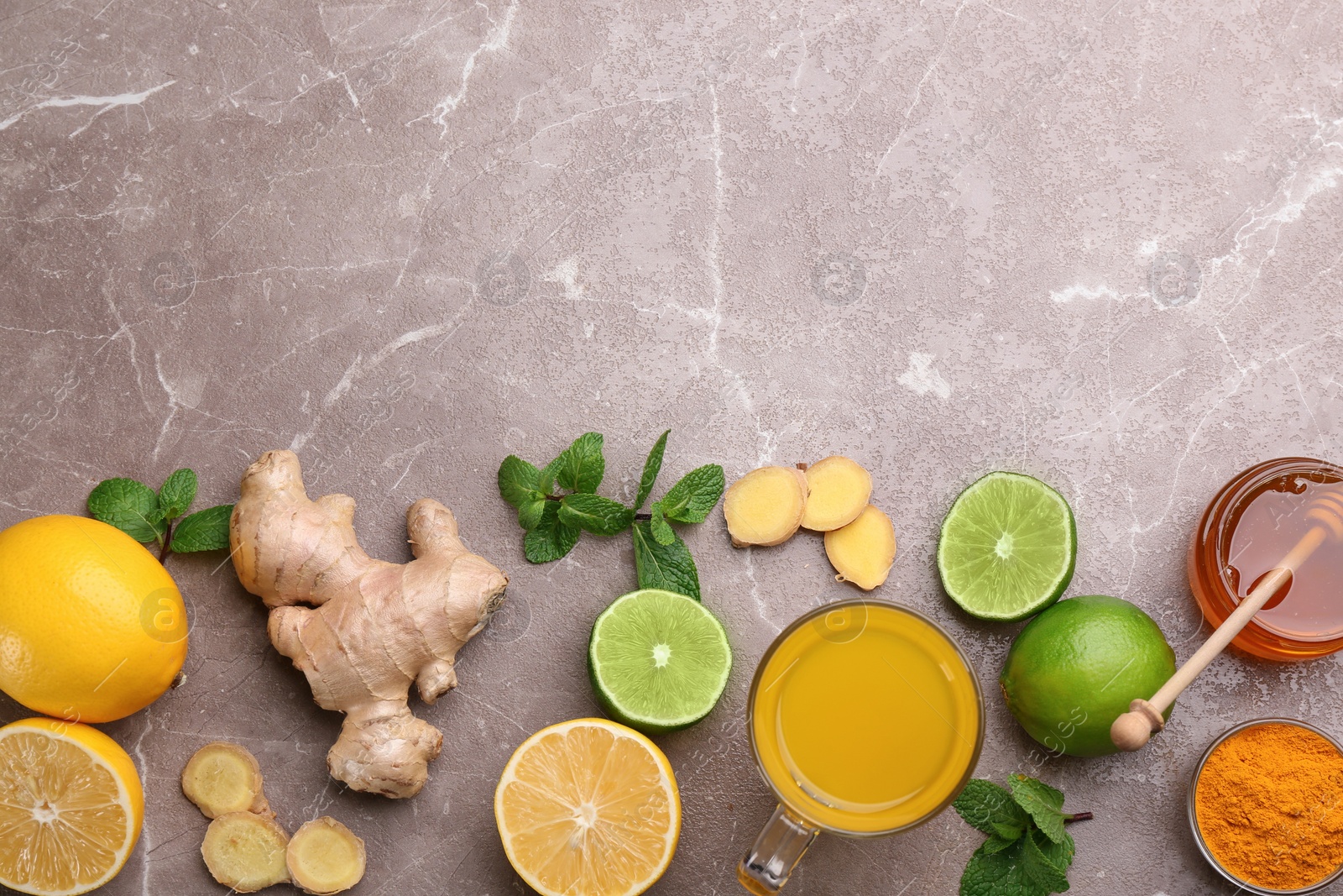 Photo of Flat lay composition with immunity boosting drink on grey table. Space for text