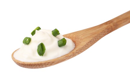 Photo of Delicious sour cream with chives in wooden spoon on white background