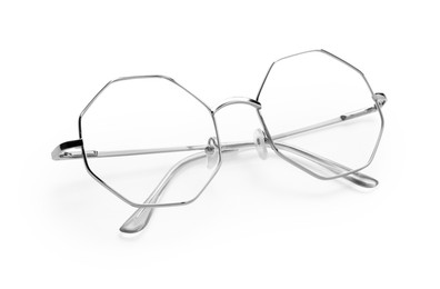 Photo of Stylish glasses with metal frame isolated on white