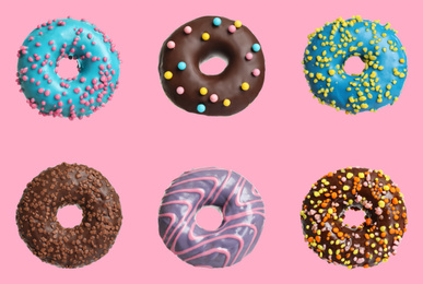 Image of Set with delicious glazed donuts on pink background