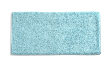 Photo of Folded soft terry towel on white background, top view