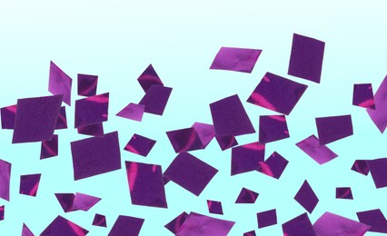 Image of Shiny purple confetti falling on gradient light blue background. Banner design
