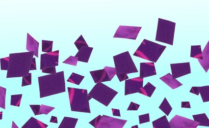 Shiny purple confetti falling on gradient light blue background. Banner design