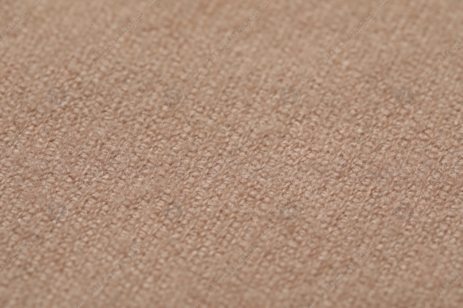 Photo of Texture of soft beige fabric as background, closeup