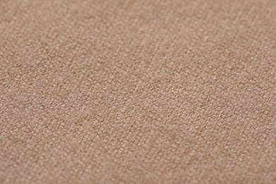 Texture of soft beige fabric as background, closeup