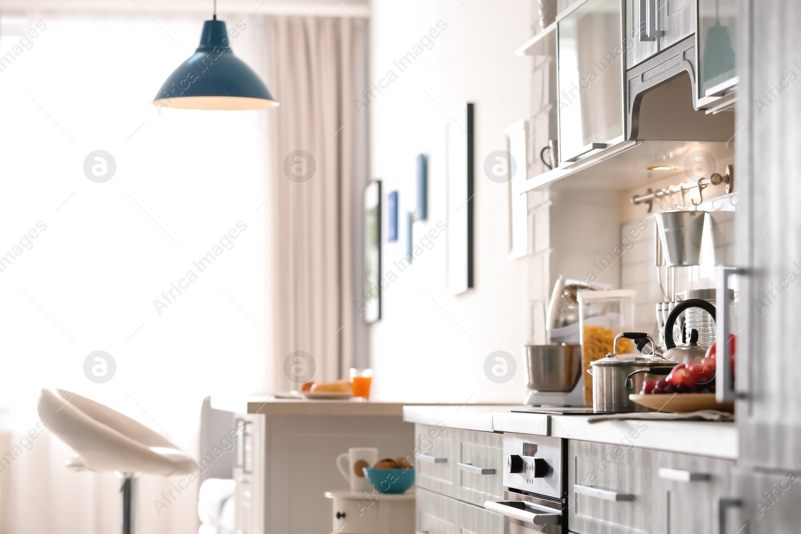 Photo of Modern kitchen interior in light apartment