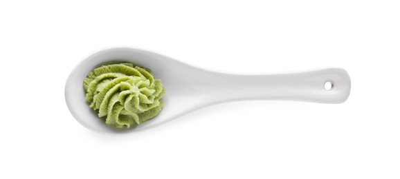 Photo of Ceramic spoon with swirl of wasabi paste isolated on white, top view