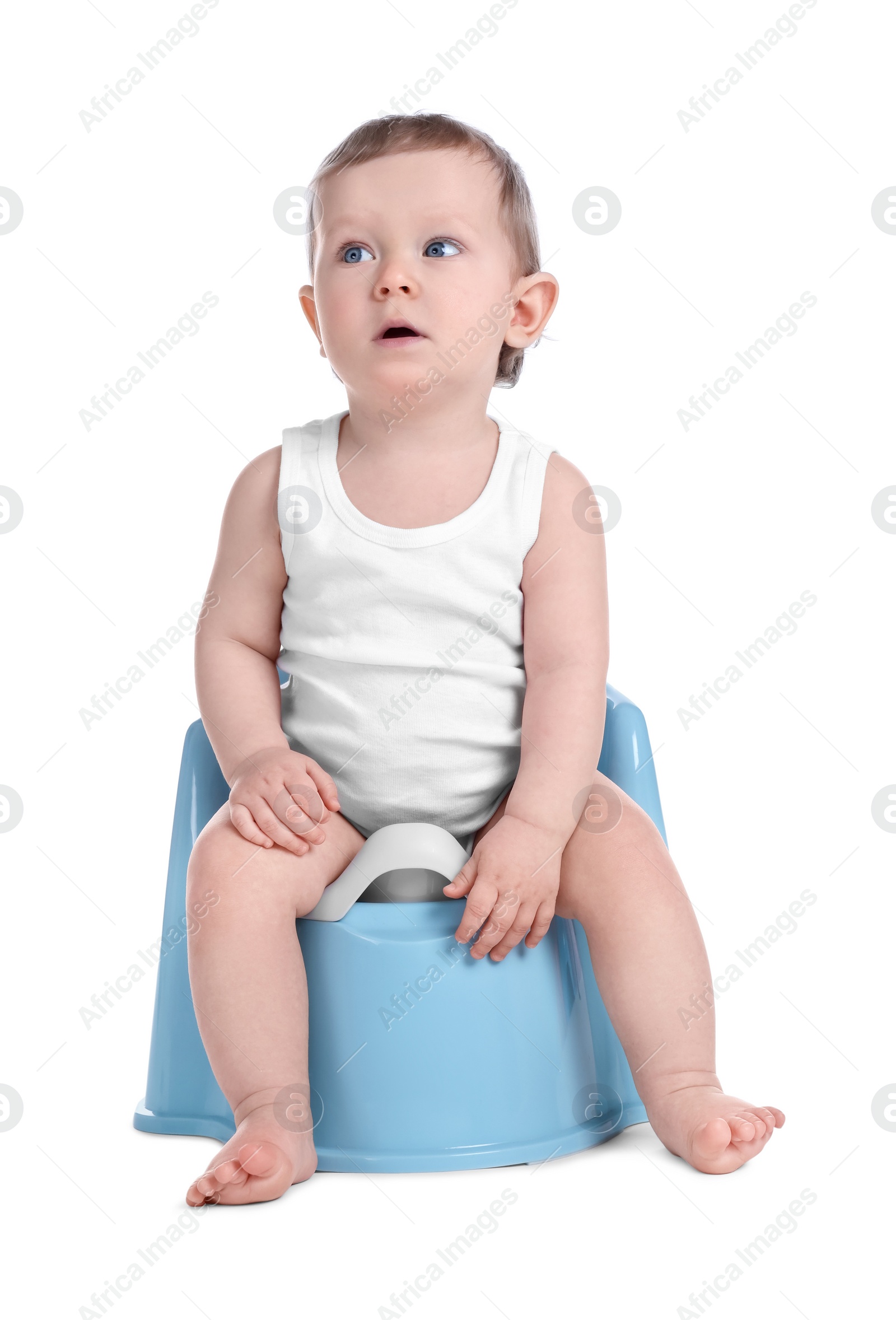 Photo of Little child sitting on baby potty against white background