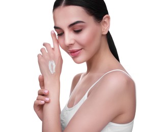 Photo of Beautiful woman with smear of body cream on her hand against white background