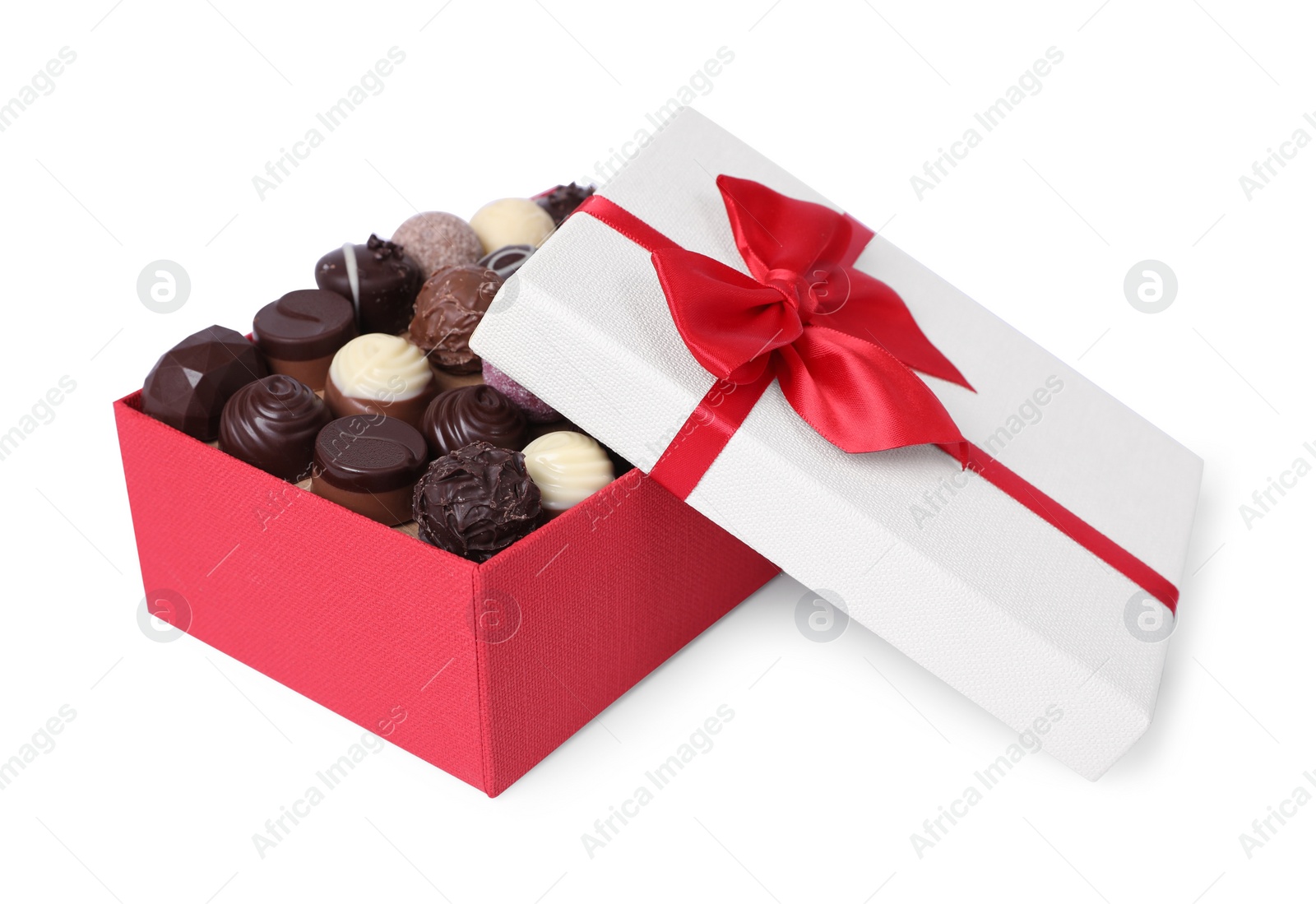 Photo of Red box with tasty chocolate candies isolated on white