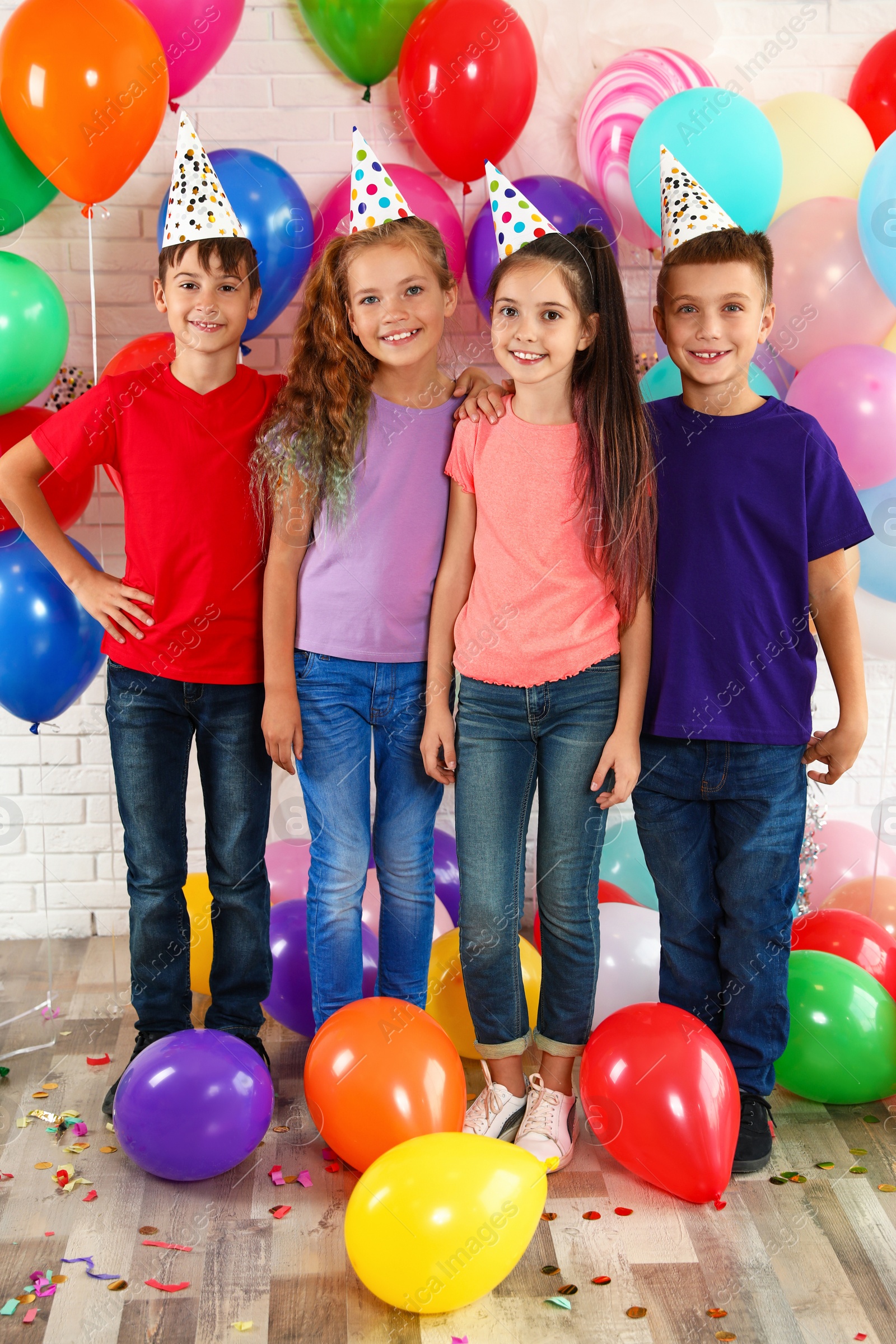 Photo of Happy children near bright balloons at birthday party indoors