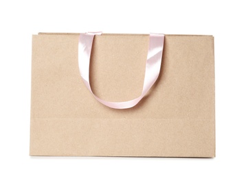 Photo of Paper shopping bag isolated on white. Mock up for design