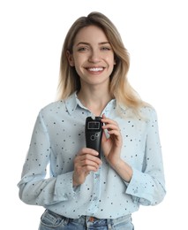 Young woman with modern breathalyzer on white background