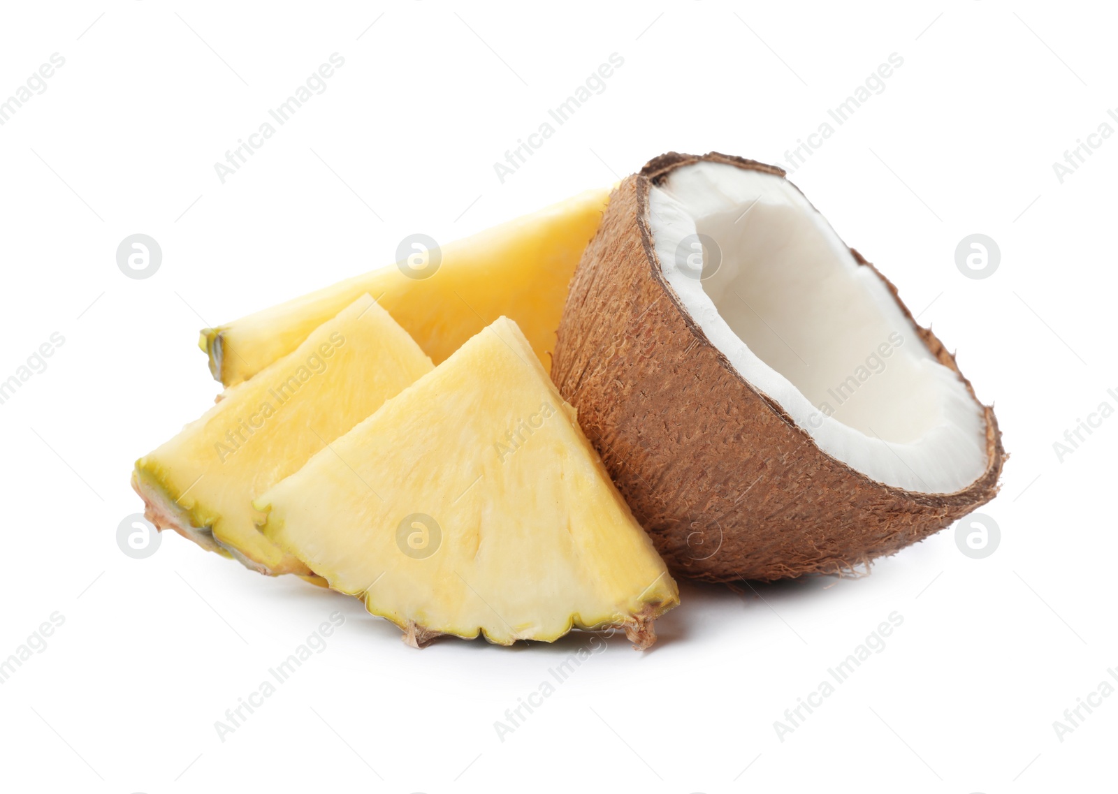 Photo of Tasty raw pineapple slices and coconut on white background