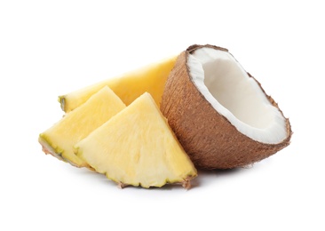 Photo of Tasty raw pineapple slices and coconut on white background