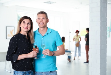 Couple at exhibition in art gallery