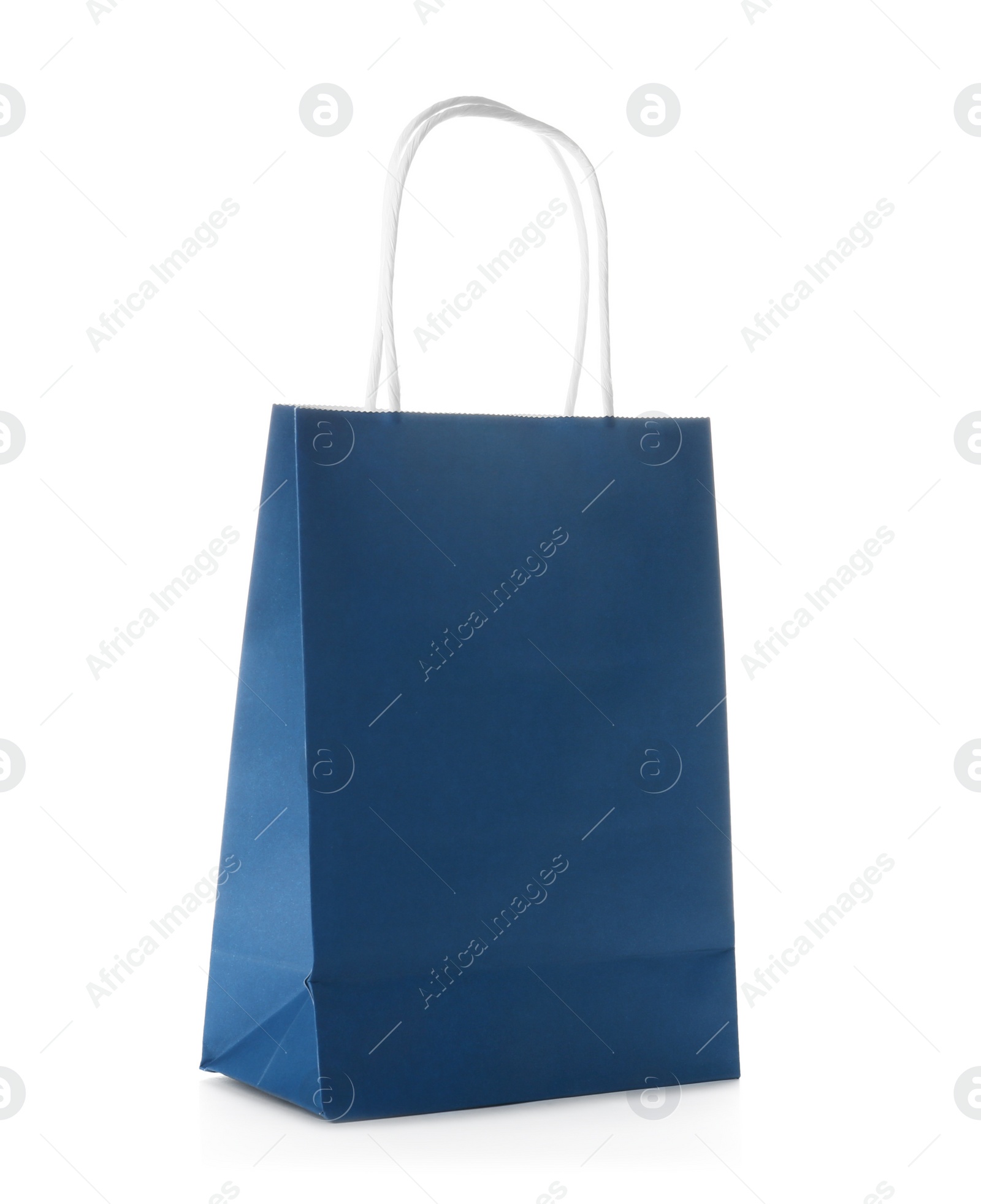 Photo of Mockup of paper shopping bag on white background