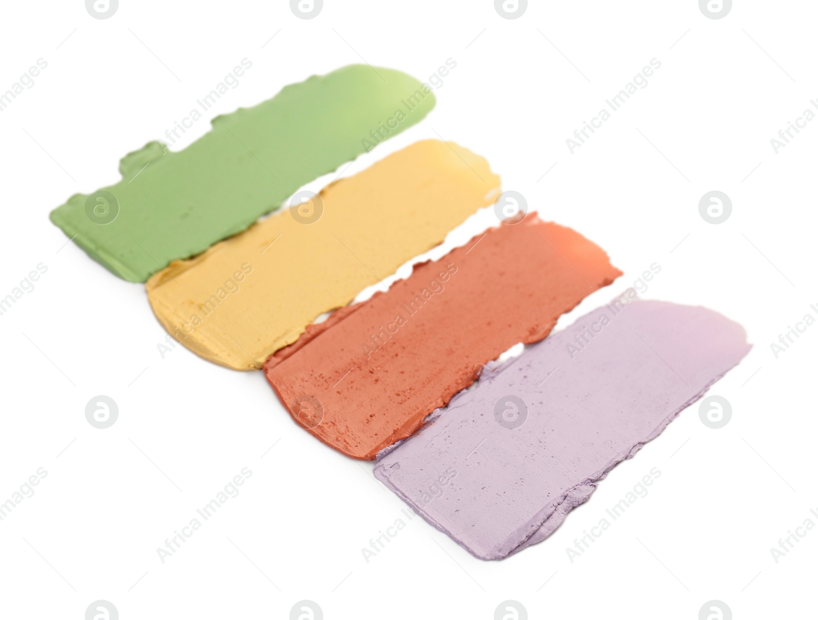 Photo of Different color correcting concealers isolated on white