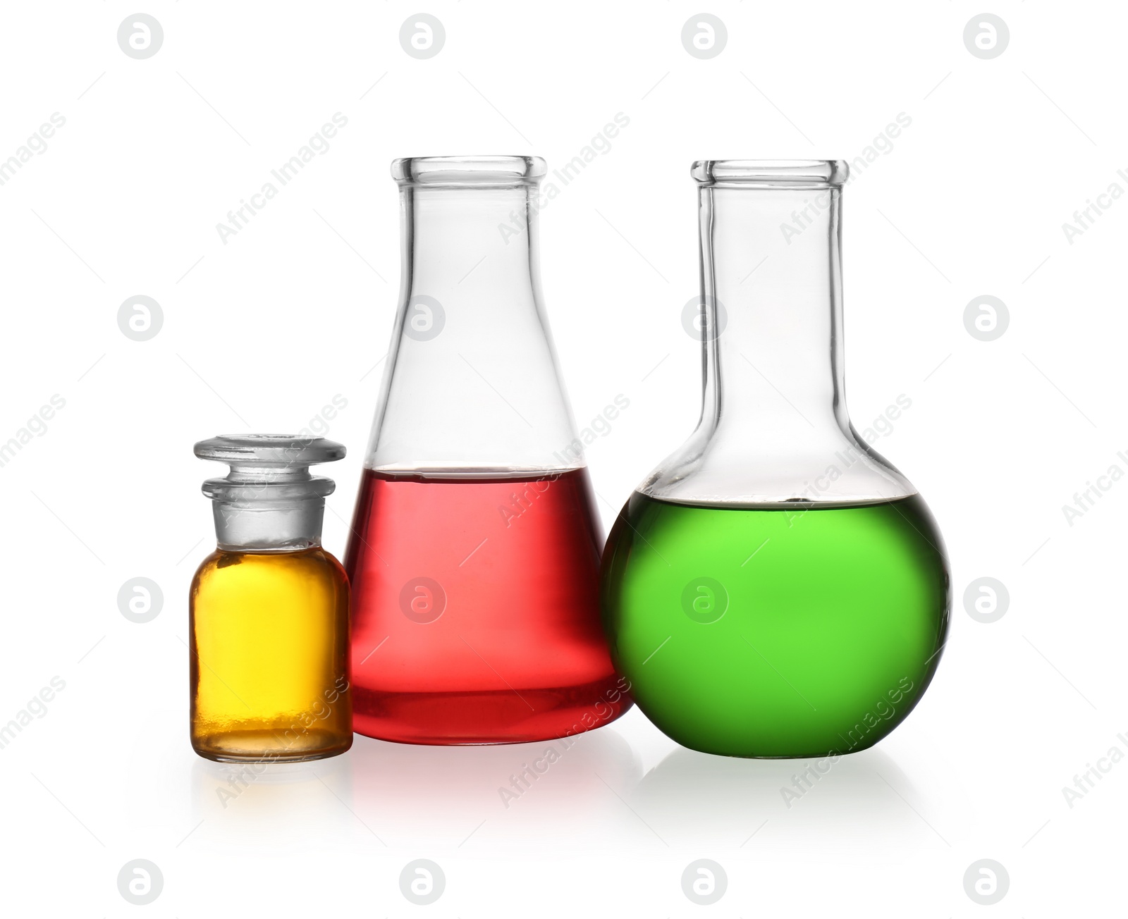 Photo of Set of lab glassware with color liquids isolated on white. Solution chemistry