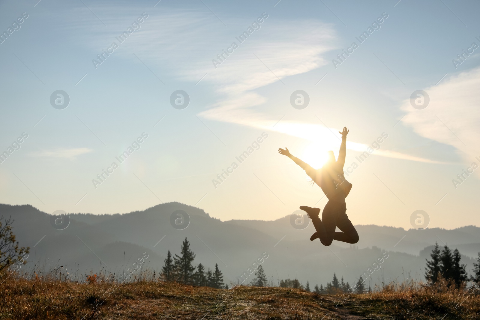 Photo of Young woman training outdoors at sunrise, space for text. Fitness lifestyle