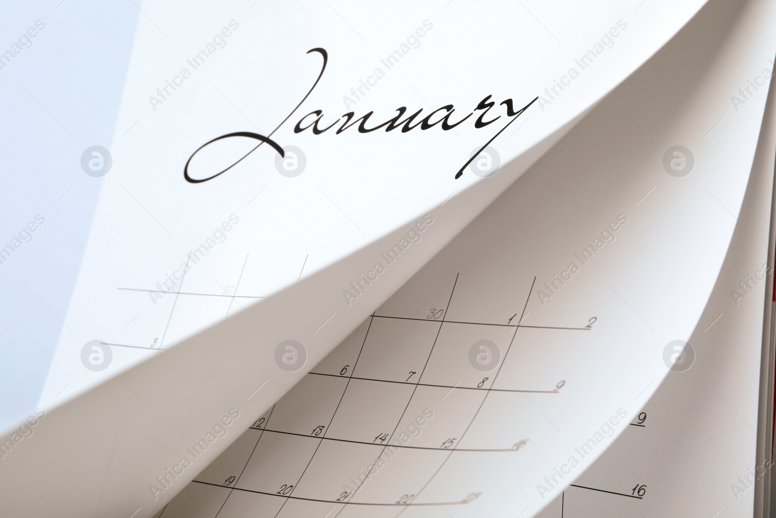 Photo of Closeup view of white paper office calendar