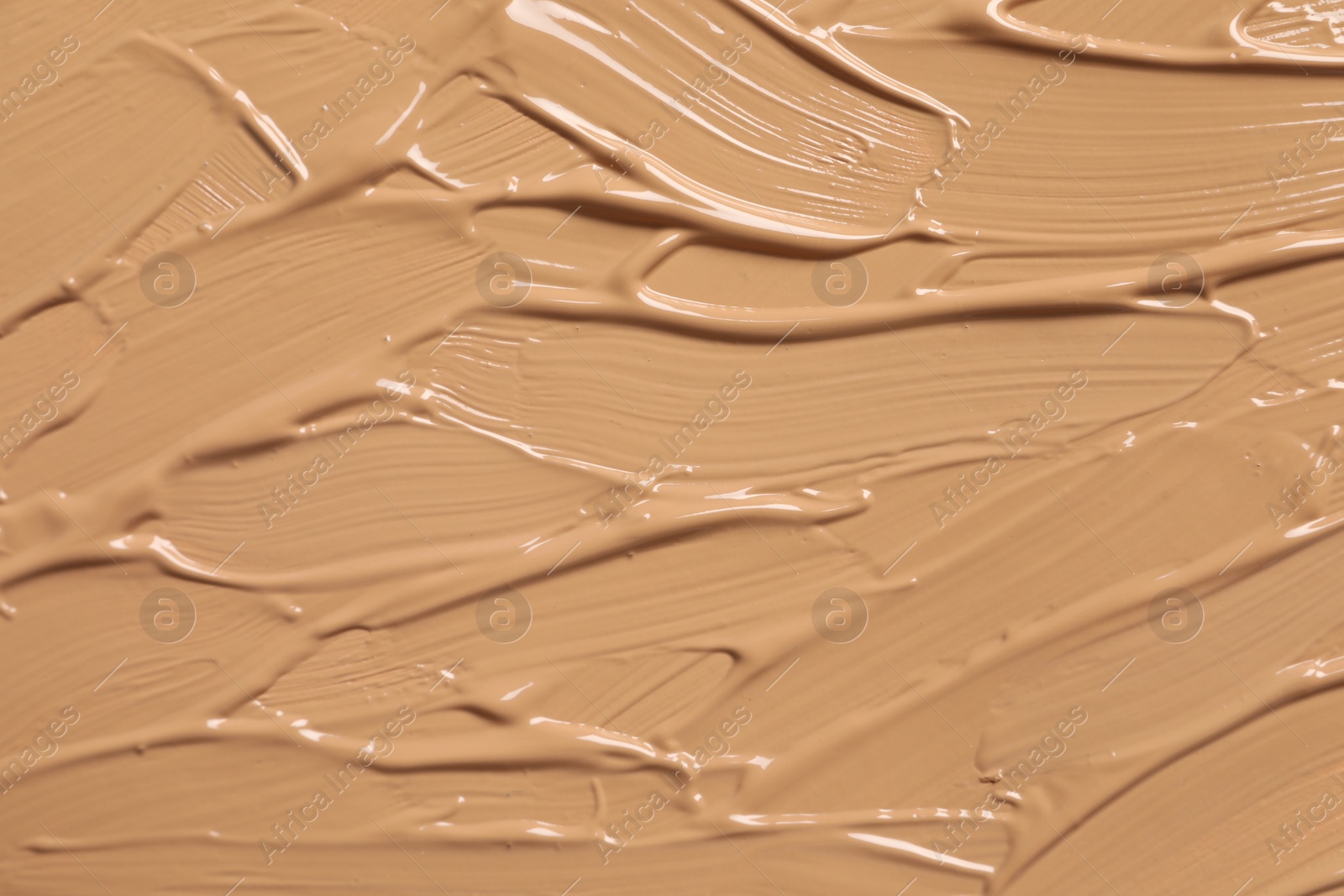 Photo of Texture of skin foundation as background, closeup