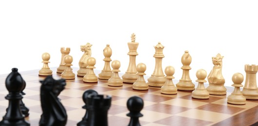 Chess pieces on wooden board against white background