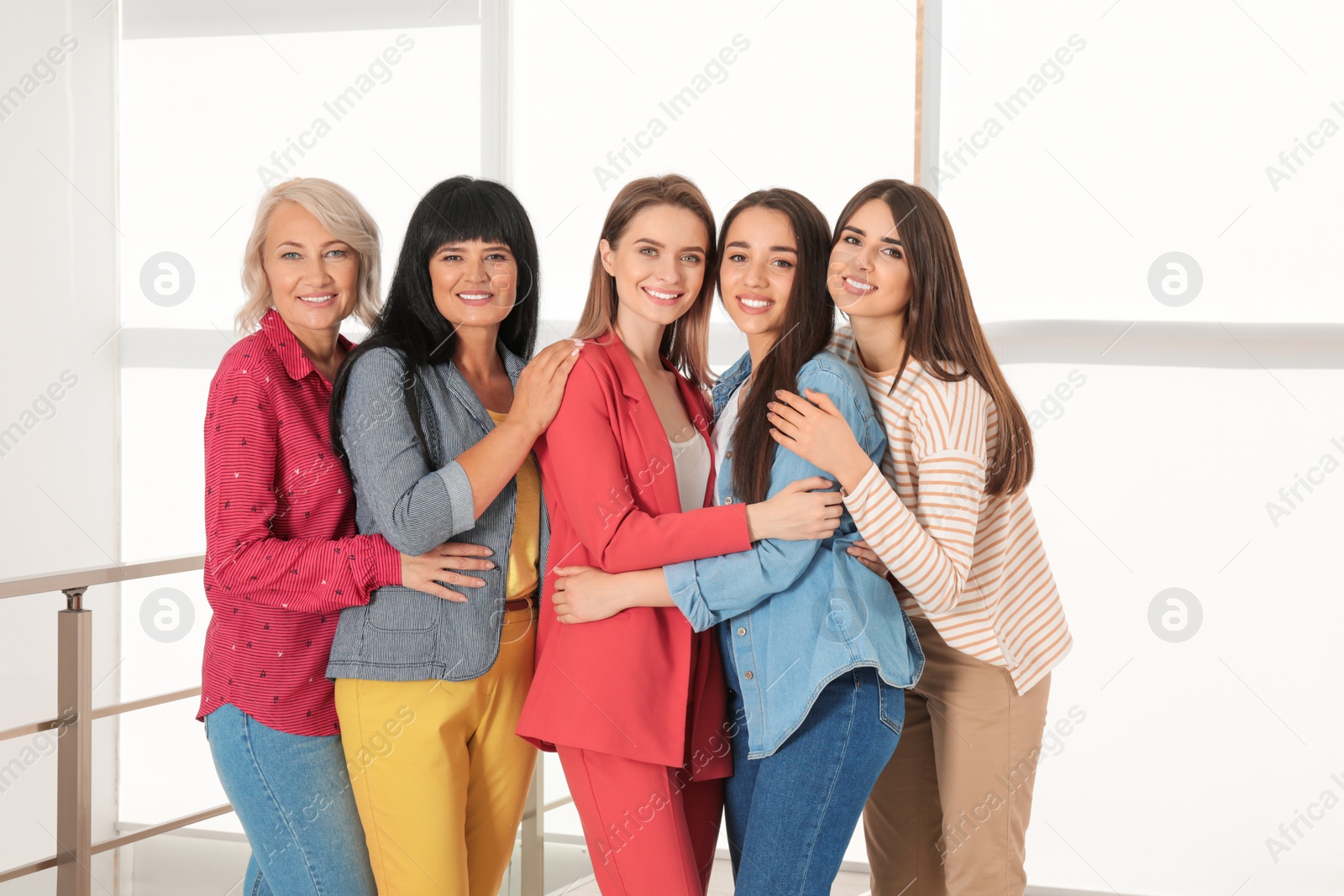 Photo of Group of ladies near window indoors. Women power concept