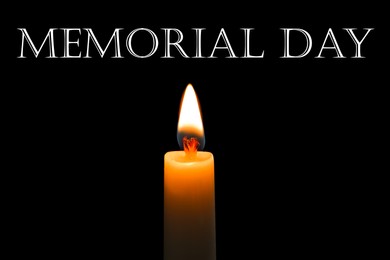 Image of Memorial day. Wax candle burning on black background