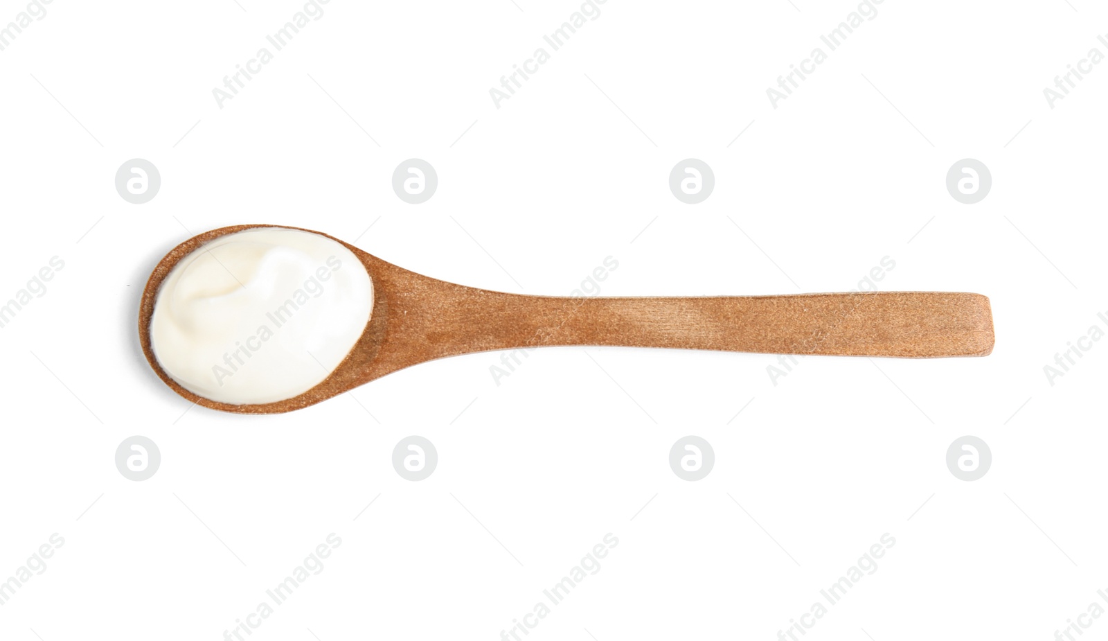 Photo of Wooden spoon with sour cream on white background, top view