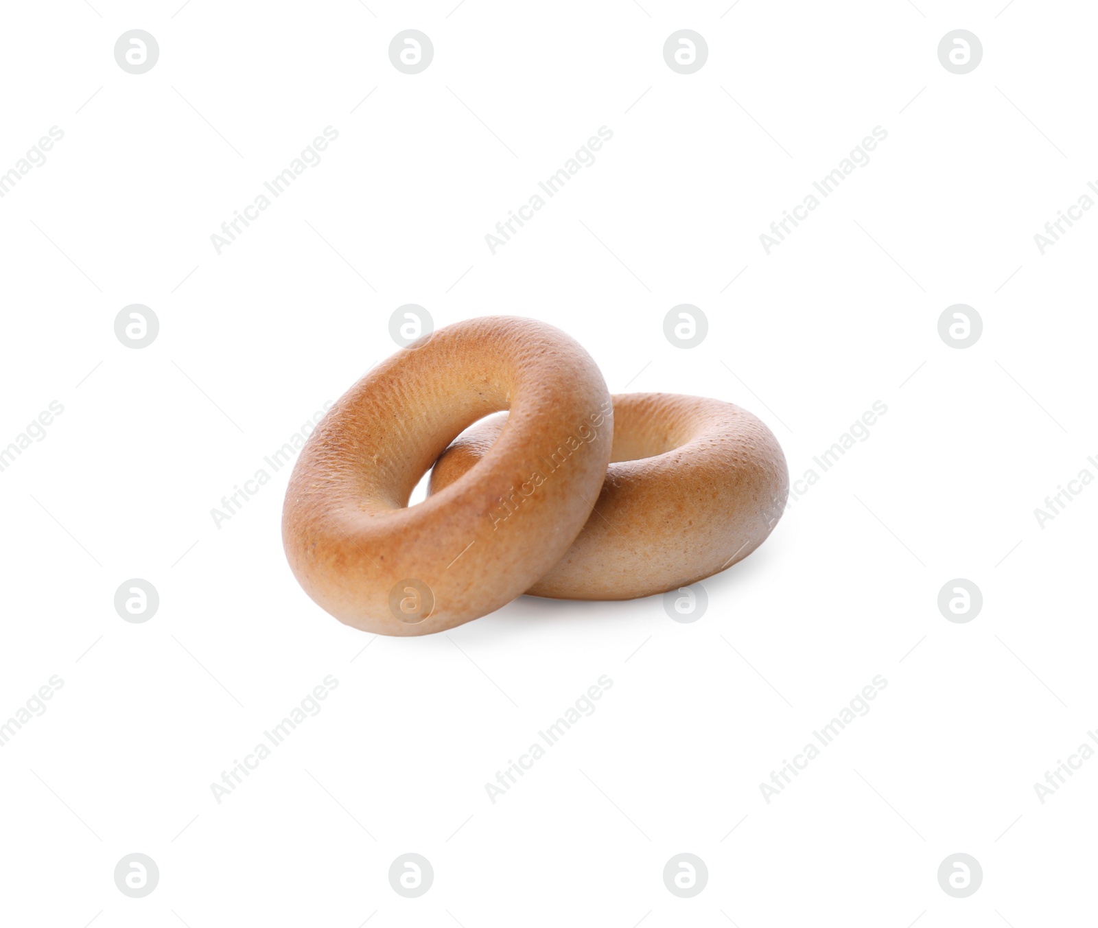 Photo of Tasty dry bagels (sushki) on white background